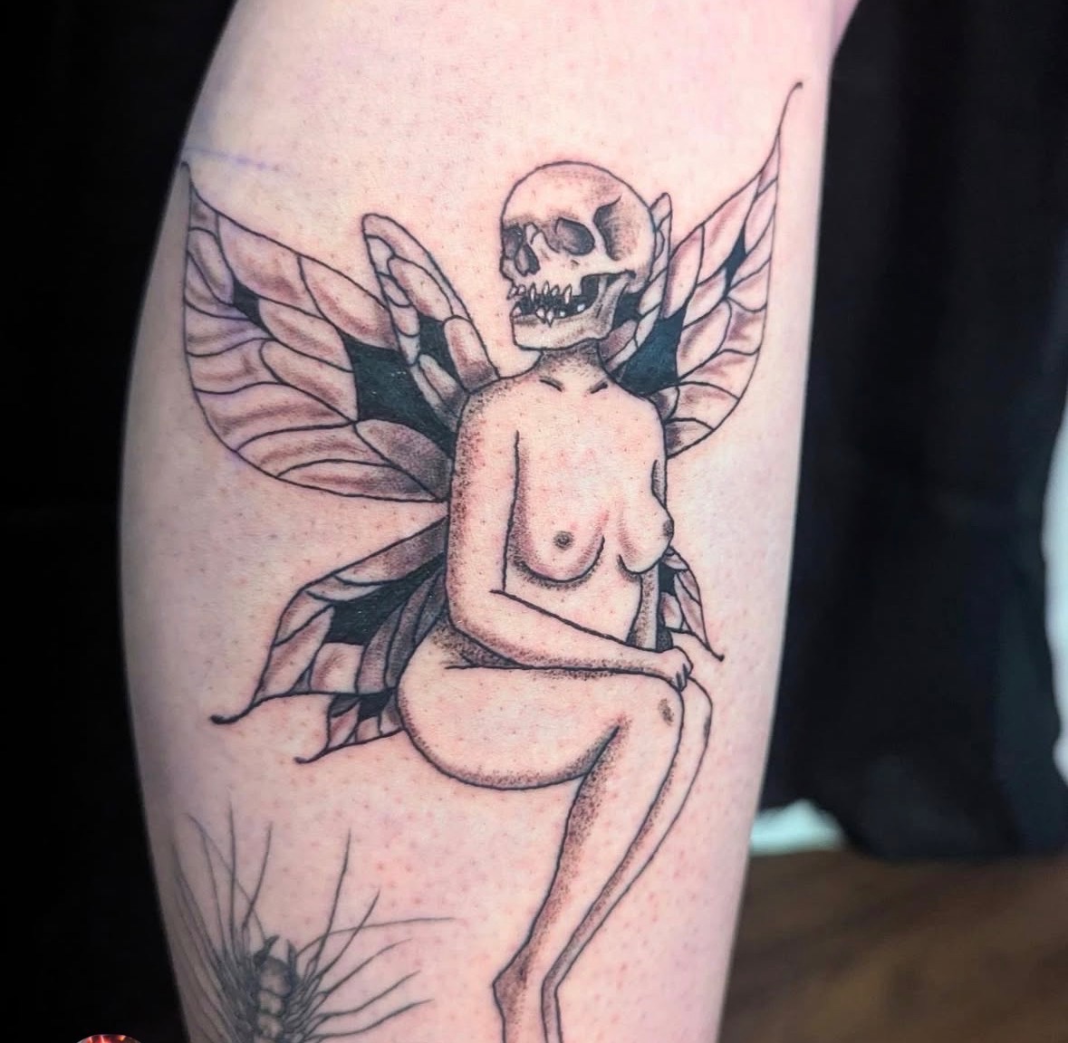 Skull fairy with moth wings tattoo