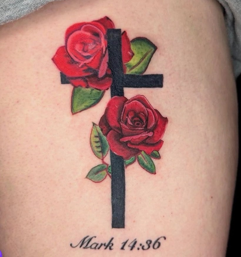 Red roses and cross tattoo