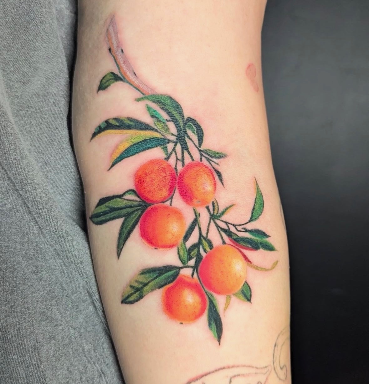 Color oranges branch tattoo