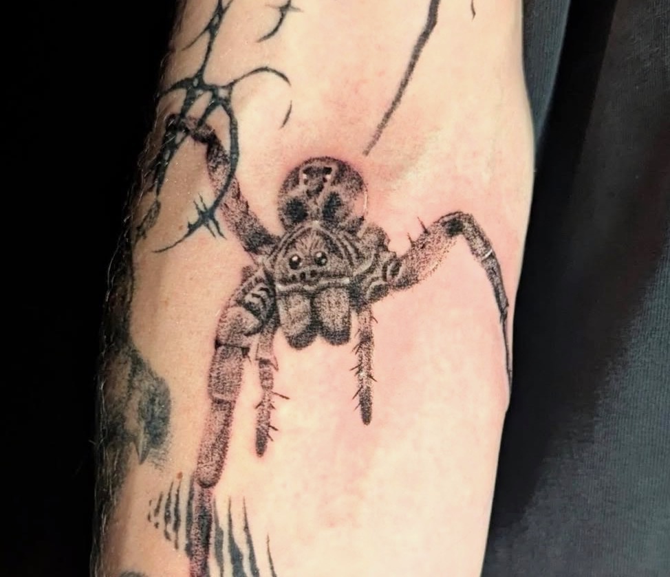 Black-and-grey jumping spider tattoo