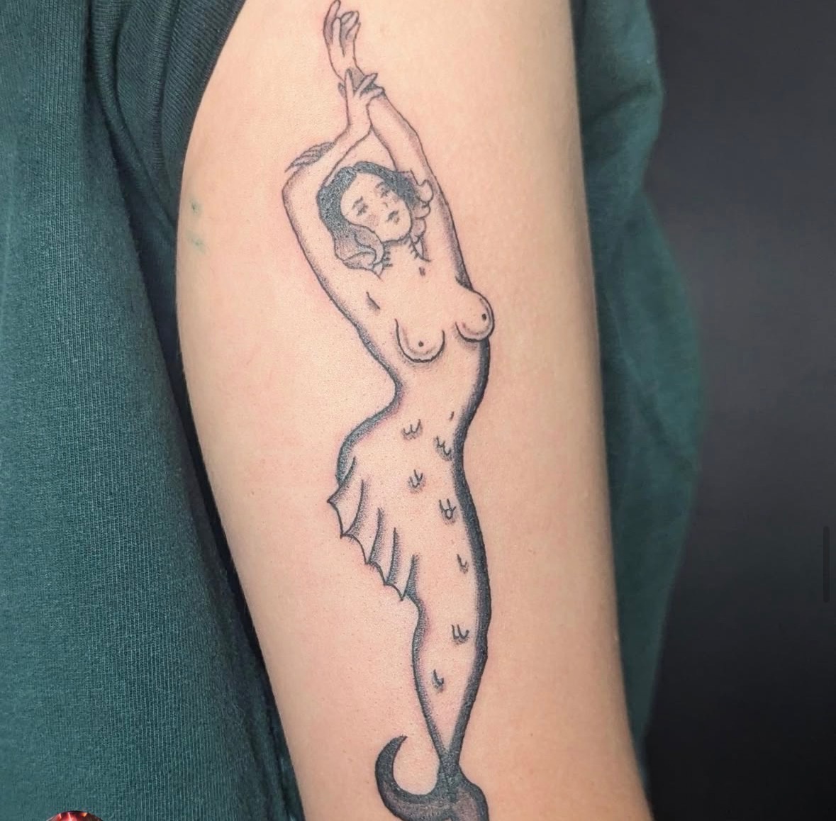 Mermaid woman tattoo